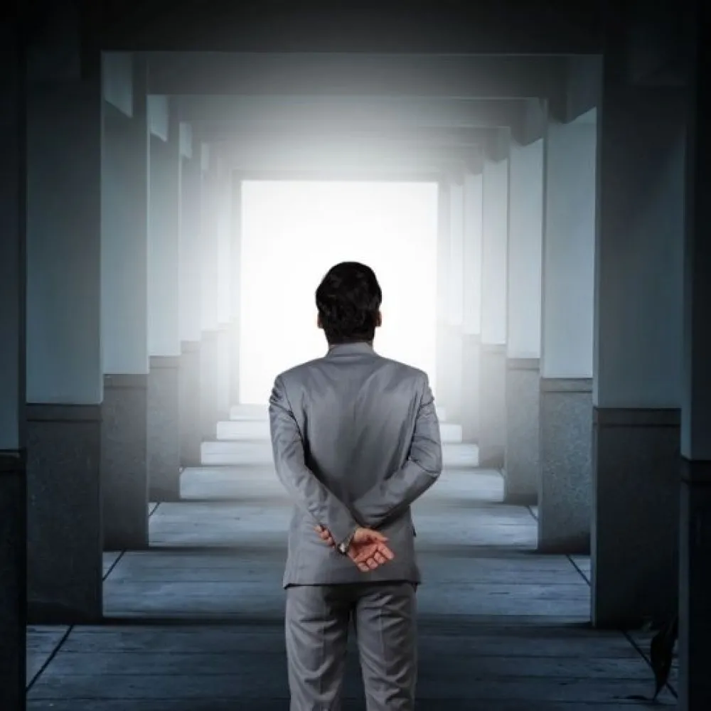 Man looking toward light